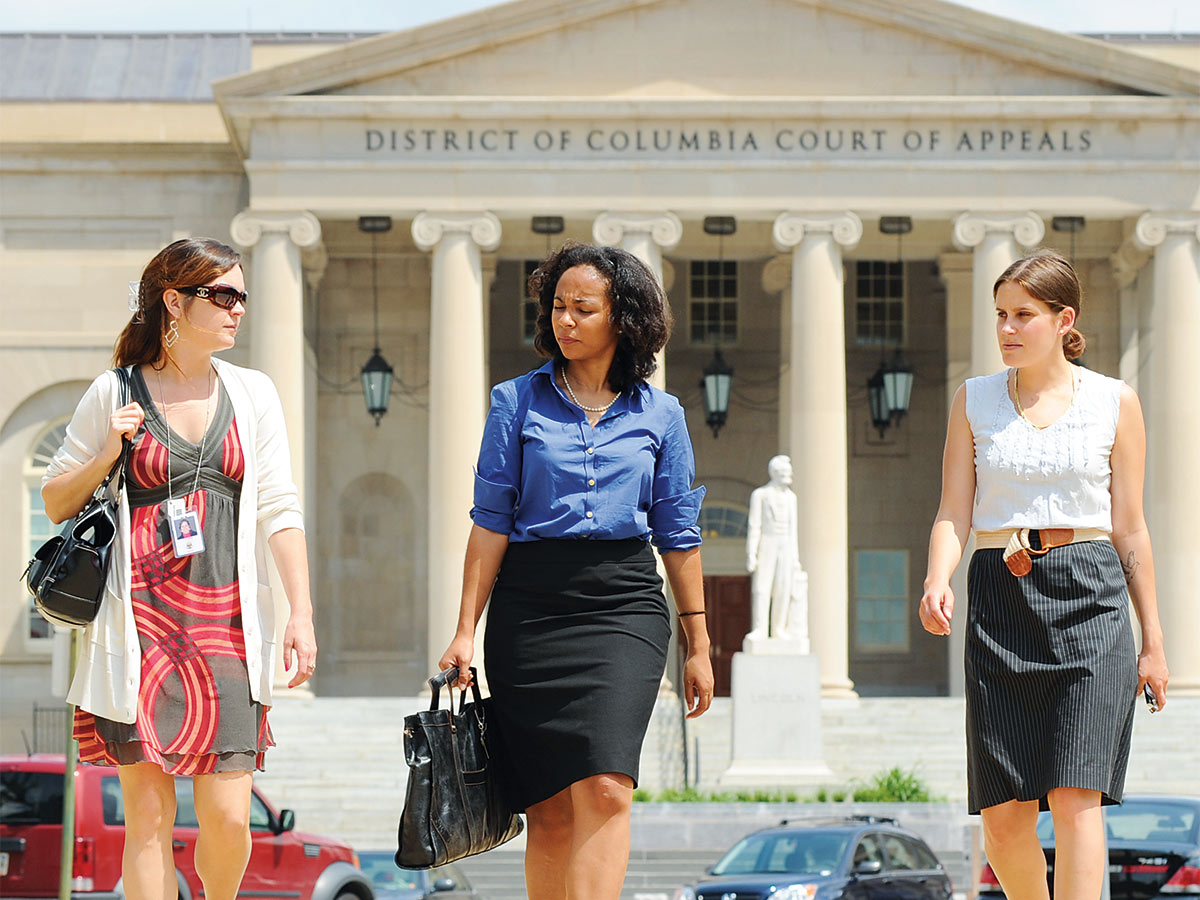 women walking in front of District of Columbia Court of Appeals