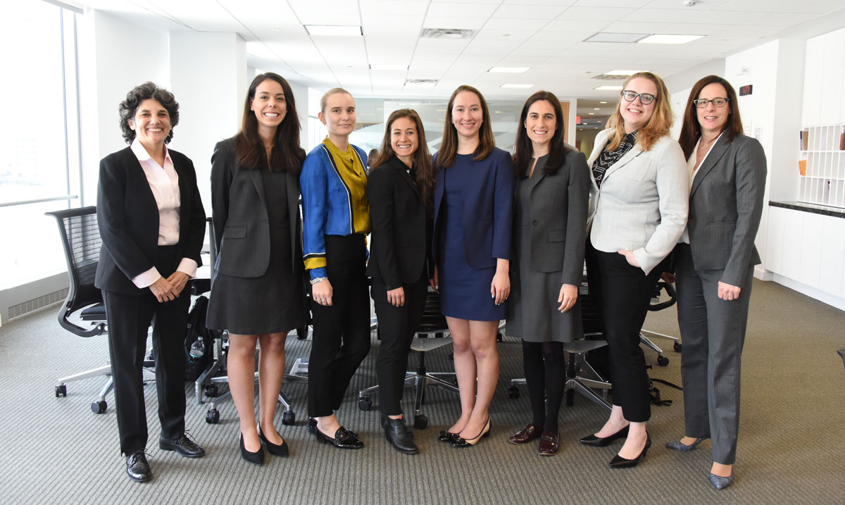 Fordham Law students and clinic professors in office