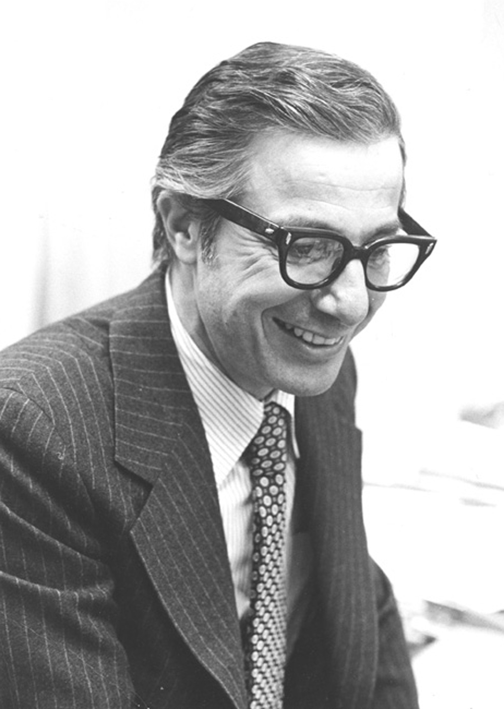 black and white image of Carl Felsenfeld wearing thick rimmed glasses