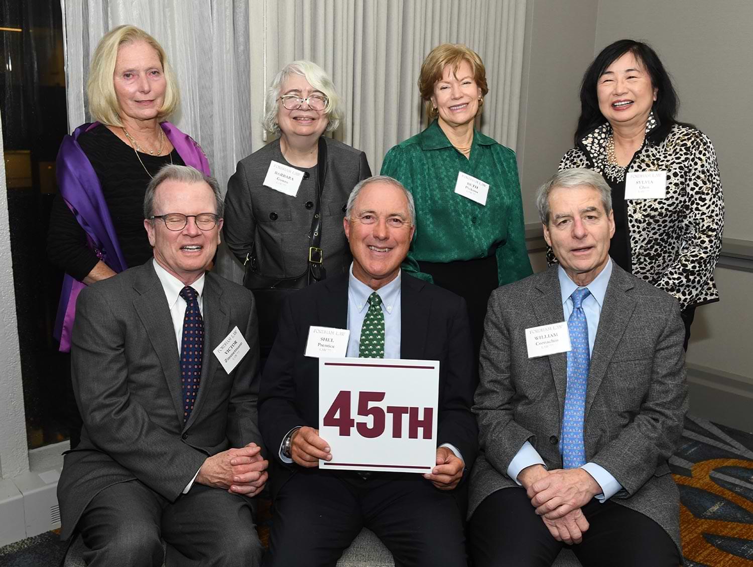 members of an alumni class celebrating their 45th reunion take a group photo