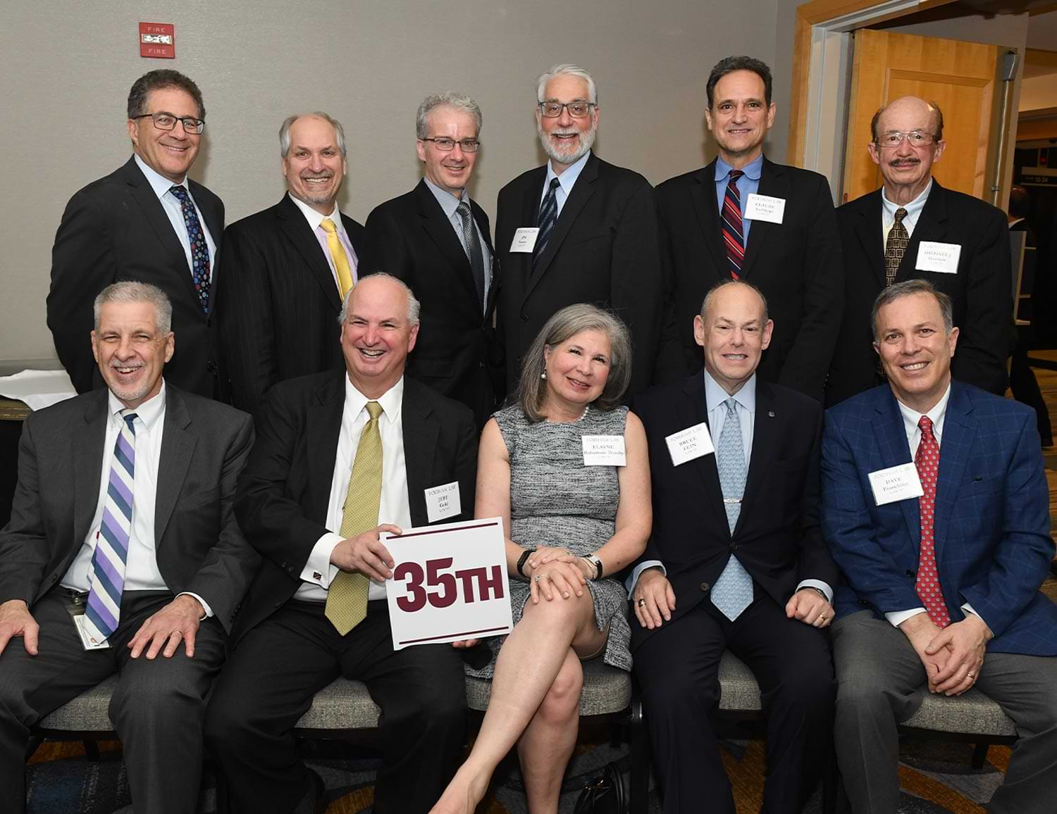 members of an alumni class celebrating their 35th reunion take a group photo