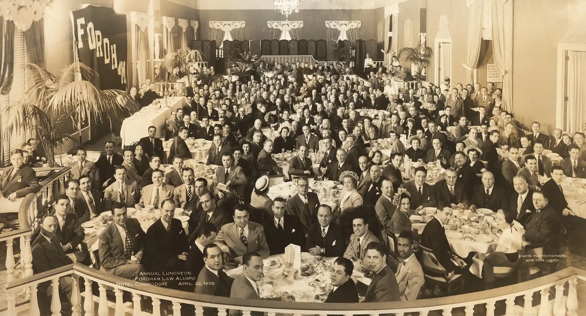 a sepia toned picture of the Fordham Law Alumni Association at their Fordham Law Annual Luncheon in 1950