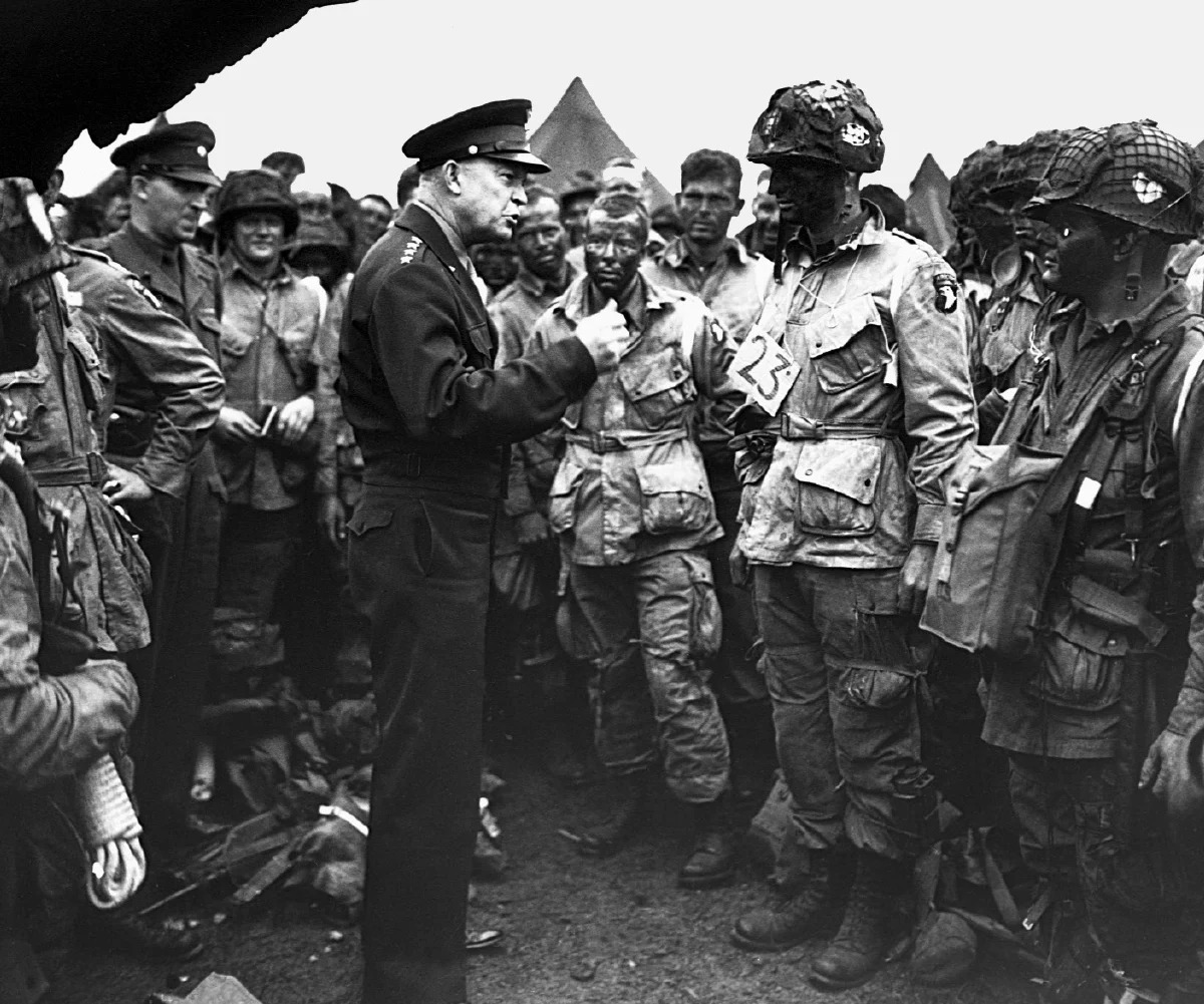 black and white photo of General Dwight D. Eisenhower giving orders to paratroopers