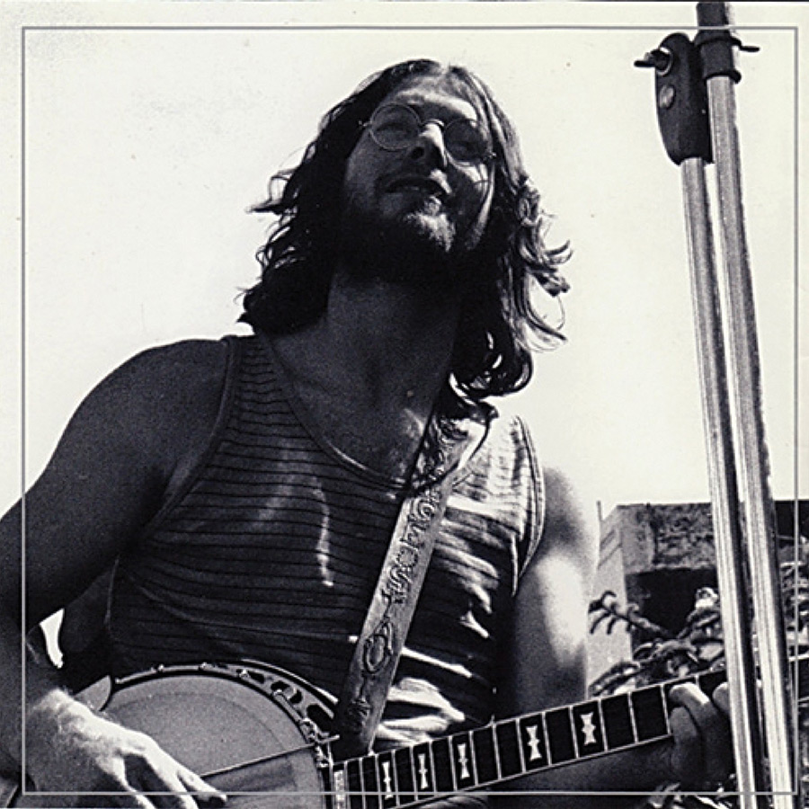 Black and white album cover featuring a young, long-haired George Stavis playing a banjo.