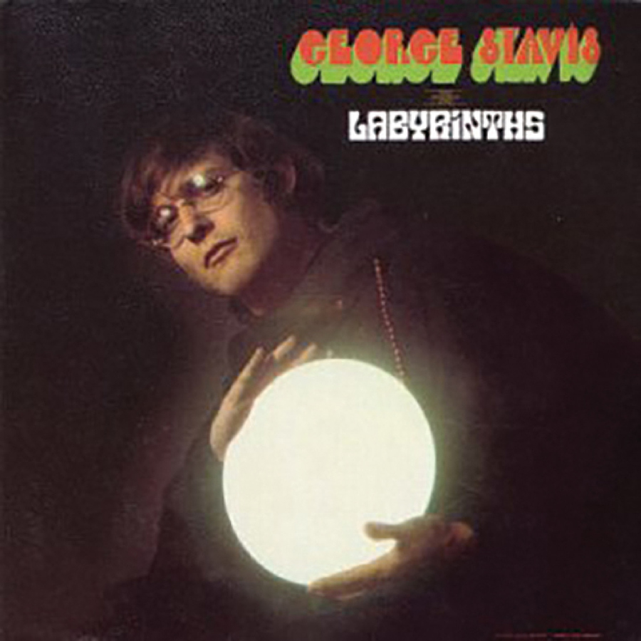 Album cover for "Labyrinths" showing George Stavis holding a large, glowing white orb.