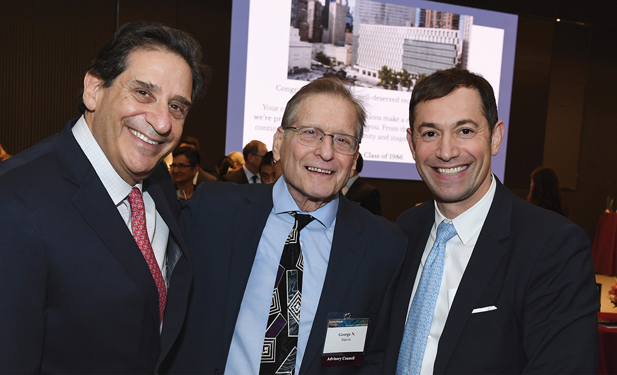 Three men in suits—George Stavis, Matthew Diller, and Joseph Landau—smile at a formal event.
